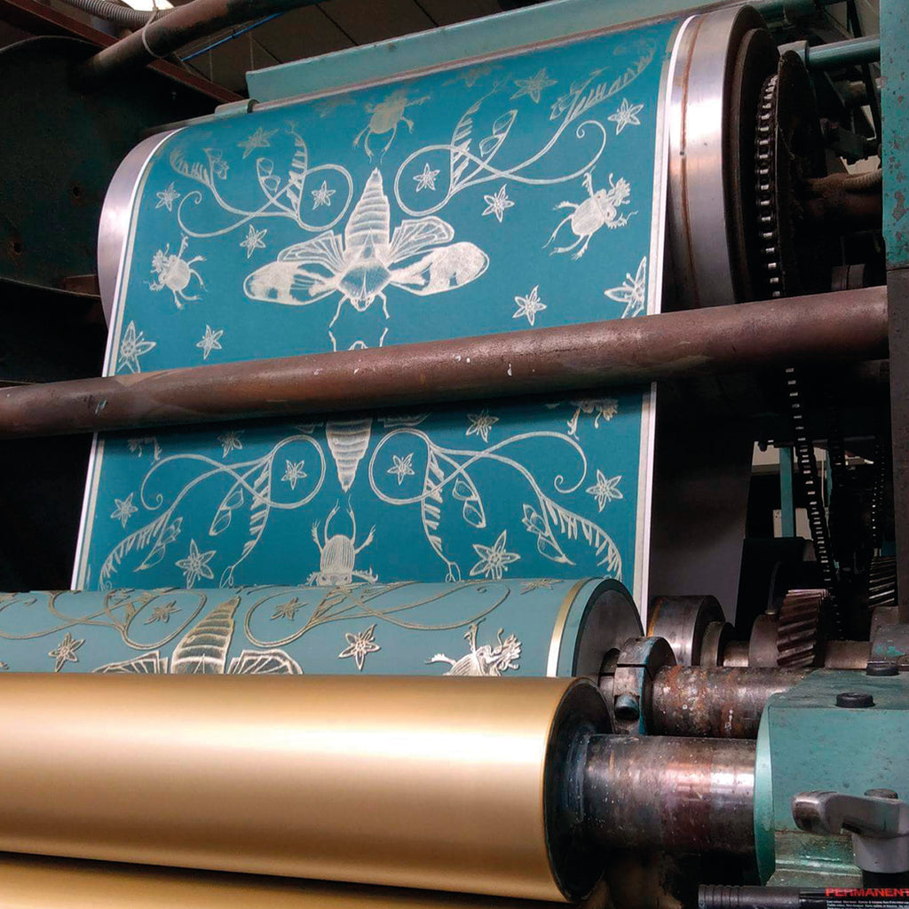 green and gold insect wallpaper being printed