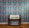 A room with patterned frog wallpaper, with the frogs sitting on brightly coloured leaves in a vivid illustration