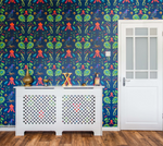 Tropical bird print wallpaper with frogs and tropical plants on a living rool wall with white furnishings